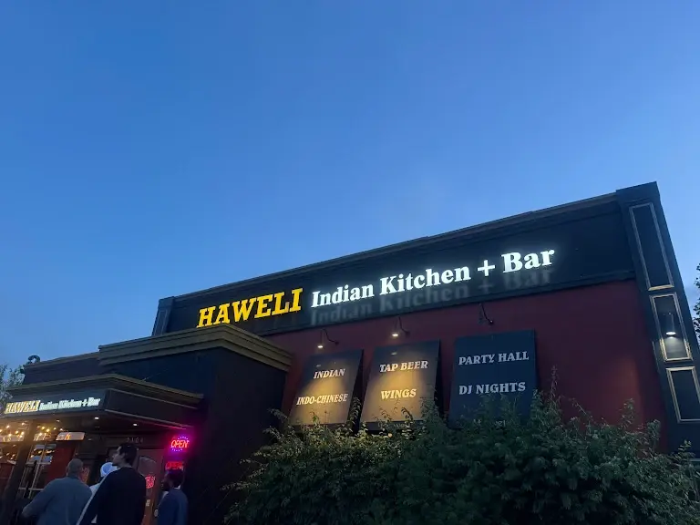 Haweli Indian Kitchen and Bar South Common Edmonton – restaurant dining area with warm Indian decor