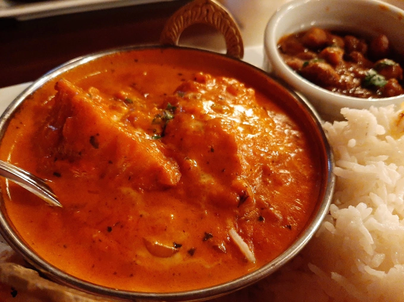 Fresh naan and bread with Indian curries at Haweli Indian Kitchen & Bar Edmonton